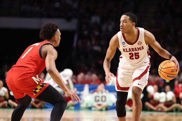Alabama Guard Nimari Burnett (25) dribbles the ball against Maryland at Legacy Arena - Birmingham in Tuscaloosa, AL on Saturday, Mar 18, 2023.